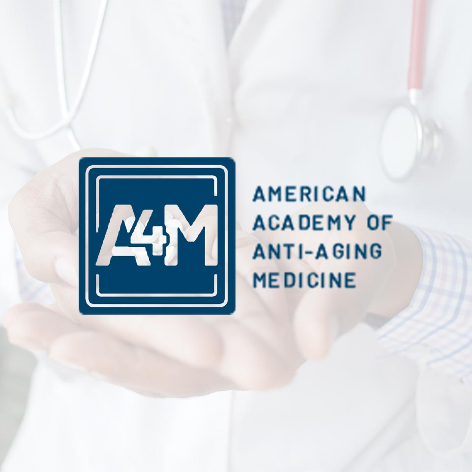 A4M Logo With Background Of Doctor Holding Pills.